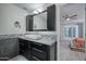 Bathroom vanity features a granite countertop, modern vessel sink, and tiled backsplash and flooring at 11035 N 37Th St, Phoenix, AZ 85028