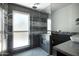 This bathroom features a large, tiled shower with a frosted window and granite countertop at 11035 N 37Th St, Phoenix, AZ 85028