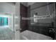 Modern bathroom featuring a glass-enclosed shower and contemporary fixtures at 11035 N 37Th St, Phoenix, AZ 85028