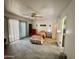 Open bedroom with neutral tile flooring and a sliding door for natural light at 11035 N 37Th St, Phoenix, AZ 85028