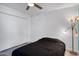 Bedroom with wood-look tile floors and a double-door closet at 11035 N 37Th St, Phoenix, AZ 85028