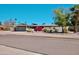 Single story home featuring desert landscaping, including colorful bougainvillea, with a two car garage at 11035 N 37Th St, Phoenix, AZ 85028