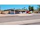 Single story home featuring desert landscaping and a two car garage with solar panels above at 11035 N 37Th St, Phoenix, AZ 85028