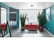 Light-filled foyer with large plants, glass block wall, and easy access to the living spaces at 11035 N 37Th St, Phoenix, AZ 85028