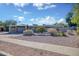 Attractive single Gathering home with desert landscaping including various cacti and flowering bushes at 11035 N 37Th St, Phoenix, AZ 85028