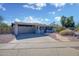 Single Gathering home featuring a two-car garage and charming desert landscaping on a sunny day at 11035 N 37Th St, Phoenix, AZ 85028