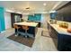 Modern kitchen featuring a large island, stainless steel appliances, and dark cabinets at 11035 N 37Th St, Phoenix, AZ 85028