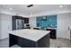 Bright kitchen featuring a large island, stainless steel appliances, and ample counter space at 11035 N 37Th St, Phoenix, AZ 85028
