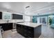 Kitchen showcasing a large island with drawers, stainless steel dishwasher, and modern cabinetry at 11035 N 37Th St, Phoenix, AZ 85028