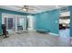 Bright living space featuring tile floors, a sliding glass door, and a tranquil seating area at 11035 N 37Th St, Phoenix, AZ 85028