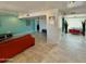 Spacious living room features an open layout and neutral tile flooring with vibrant accent colors at 11035 N 37Th St, Phoenix, AZ 85028