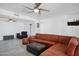 Bright and open living room featuring tile flooring and a comfortable leather sectional sofa at 11035 N 37Th St, Phoenix, AZ 85028