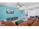 Open-concept living room with sleek tile flooring, modern fan, and a spacious layout at 11035 N 37Th St, Phoenix, AZ 85028