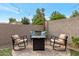 Outdoor seating area features a fire pit, comfortable chairs and privacy wall at 1138 E Liberty Shores Dr, Gilbert, AZ 85234