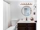Bathroom with a vanity, round mirror, updated fixtures and great lighting at 1138 E Liberty Shores Dr, Gilbert, AZ 85234
