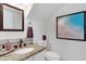 Stylish bathroom features granite counters, a decorative mirror, updated fixtures, and modern decor at 1138 E Liberty Shores Dr, Gilbert, AZ 85234