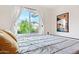 Bright bedroom with a large window providing scenic outdoor views and natural light at 1138 E Liberty Shores Dr, Gilbert, AZ 85234