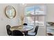 Cozy breakfast nook features a round table with seating and a view of the outdoor patio area at 1138 E Liberty Shores Dr, Gilbert, AZ 85234