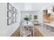 Bright dining room boasts decor, a white table, and ample natural light for comfortable, stylish meals at 1138 E Liberty Shores Dr, Gilbert, AZ 85234