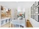 Inviting dining room with a white table, stylish decor, and built-in storage for a modern, organized space at 1138 E Liberty Shores Dr, Gilbert, AZ 85234