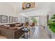 Well-lit living room showcases modern decor, with a comfortable couch, and large sliding doors to the backyard at 1138 E Liberty Shores Dr, Gilbert, AZ 85234