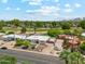 Aerial view of property with a well-manicured yard, mature landscaping, and scenic views at 14401 N Coral Gables Dr, Phoenix, AZ 85023