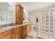 Bathroom featuring double sinks, a granite countertop, and a privacy glass block shower at 14401 N Coral Gables Dr, Phoenix, AZ 85023