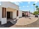 Inviting front exterior with desert landscape and a charming courtyard featuring a wooden pergola at 14401 N Coral Gables Dr, Phoenix, AZ 85023