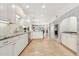 Bright kitchen with white cabinets, granite countertops, and stainless steel appliances at 14401 N Coral Gables Dr, Phoenix, AZ 85023
