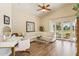 Inviting living room featuring a vaulted ceiling and patio access at 14401 N Coral Gables Dr, Phoenix, AZ 85023