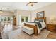 Spacious main bedroom with a private patio access and wood-look floors at 14401 N Coral Gables Dr, Phoenix, AZ 85023