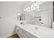Well-lit bathroom with double sink vanity, and a large mirror at 1748 E Cortez Dr, Gilbert, AZ 85234