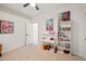 bedroom featuring carpet, ample natural light, and playful decor at 1748 E Cortez Dr, Gilbert, AZ 85234