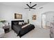 Bright main bedroom boasts a ceiling fan and arched entryway at 1748 E Cortez Dr, Gilbert, AZ 85234