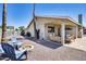 Relaxing backyard featuring a covered patio, fire pit, and comfortable seating arrangements at 18642 N 13Th Ave, Phoenix, AZ 85027