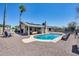 Beautiful backyard showcasing a sparkling pool, covered patio, and outdoor seating areas at 18642 N 13Th Ave, Phoenix, AZ 85027