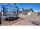 Outdoor trampoline in a spacious backyard featuring solar panels and desert landscaping at 18642 N 13Th Ave, Phoenix, AZ 85027