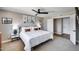 Comfortable bedroom featuring a ceiling fan, neutral tones, and ample closet space for a relaxing retreat at 18642 N 13Th Ave, Phoenix, AZ 85027