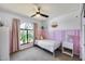 Charming bedroom featuring a large window, pink accents, and a cozy atmosphere perfect for a space at 18642 N 13Th Ave, Phoenix, AZ 85027