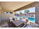 Charming covered patio overlooking the pool, complete with comfortable seating and stylish decor at 18642 N 13Th Ave, Phoenix, AZ 85027
