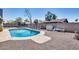 Spacious backyard with a refreshing pool, lounge chairs, and well-maintained landscaping at 18642 N 13Th Ave, Phoenix, AZ 85027