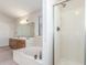 Bright primary bathroom featuring a soaking tub and glass shower enclosure at 221 N Ironwood St, Gilbert, AZ 85234