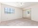Bright bedroom with a window and mirrored closet doors, offering ample storage at 221 N Ironwood St, Gilbert, AZ 85234