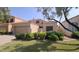 Charming home featuring a well-manicured front yard and a two-car garage, creating curb appeal at 221 N Ironwood St, Gilbert, AZ 85234