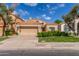 Charming single-story home with a two-car garage, beautiful landscaping, and a terracotta tile roof at 221 N Ironwood St, Gilbert, AZ 85234
