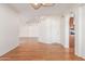 Spacious living room with wood floors, a staircase, and an open floor plan with archways at 221 N Ironwood St, Gilbert, AZ 85234