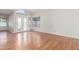 Bright living room with wood floors, large windows, and a sliding door to the backyard at 221 N Ironwood St, Gilbert, AZ 85234