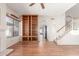 Open living room with wood floors, a fireplace, and staircase at 221 N Ironwood St, Gilbert, AZ 85234