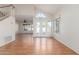 Bright living room with wood floors, high ceilings, and doors leading to the backyard pool at 221 N Ironwood St, Gilbert, AZ 85234