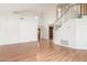 Bright living room featuring soaring ceilings, hardwood floors, and staircase at 221 N Ironwood St, Gilbert, AZ 85234